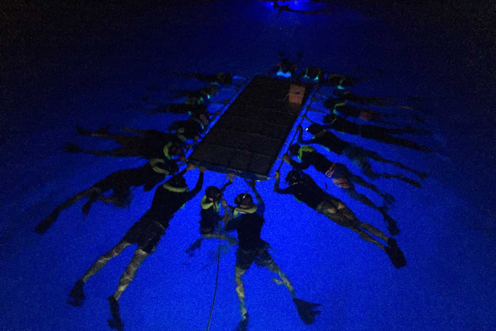 a group of people in a dark room